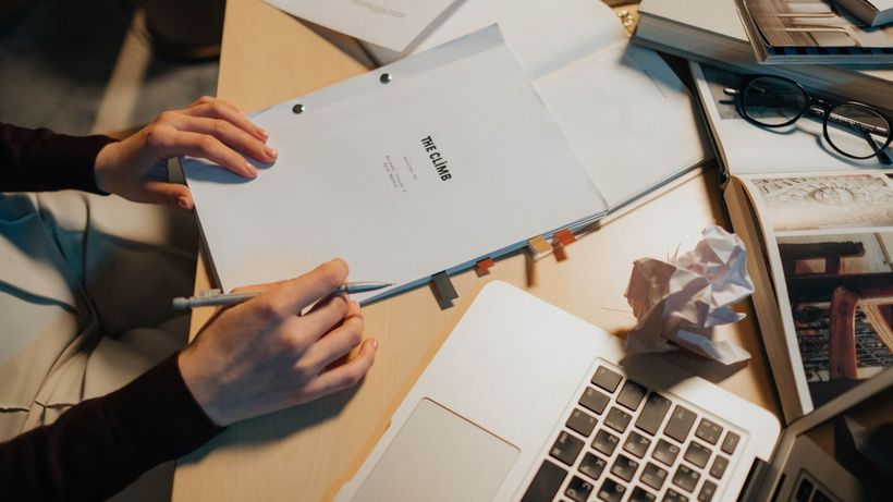 Cozy desk with screenplay, perfect for writing and research