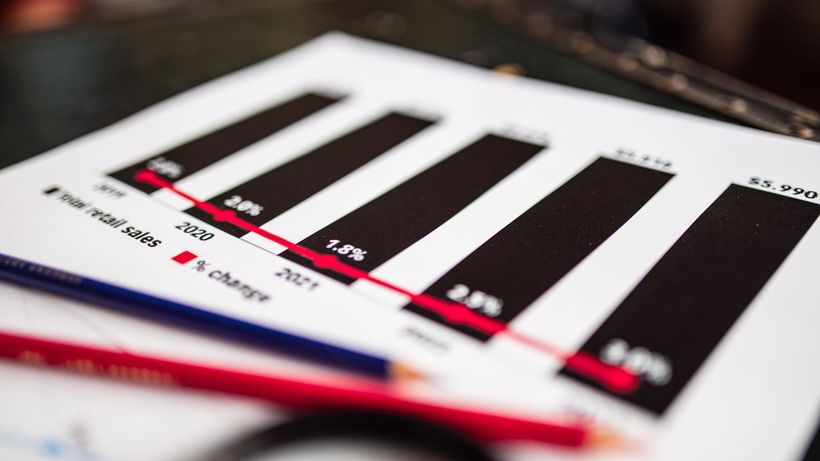Close-up of a financial report showing sales data with dramatic depth of field