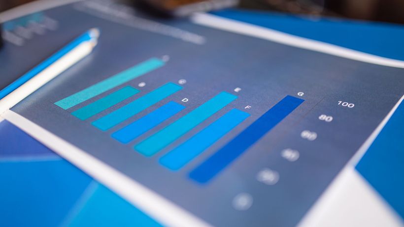 Detailed close-up of a blue bar graph showing data analysis on printed paper
