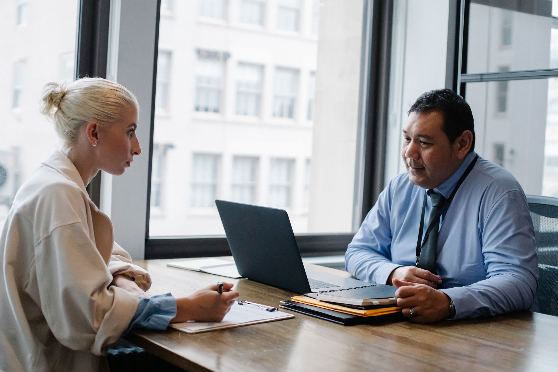 Recruiter reviewing a candidate at an office desk