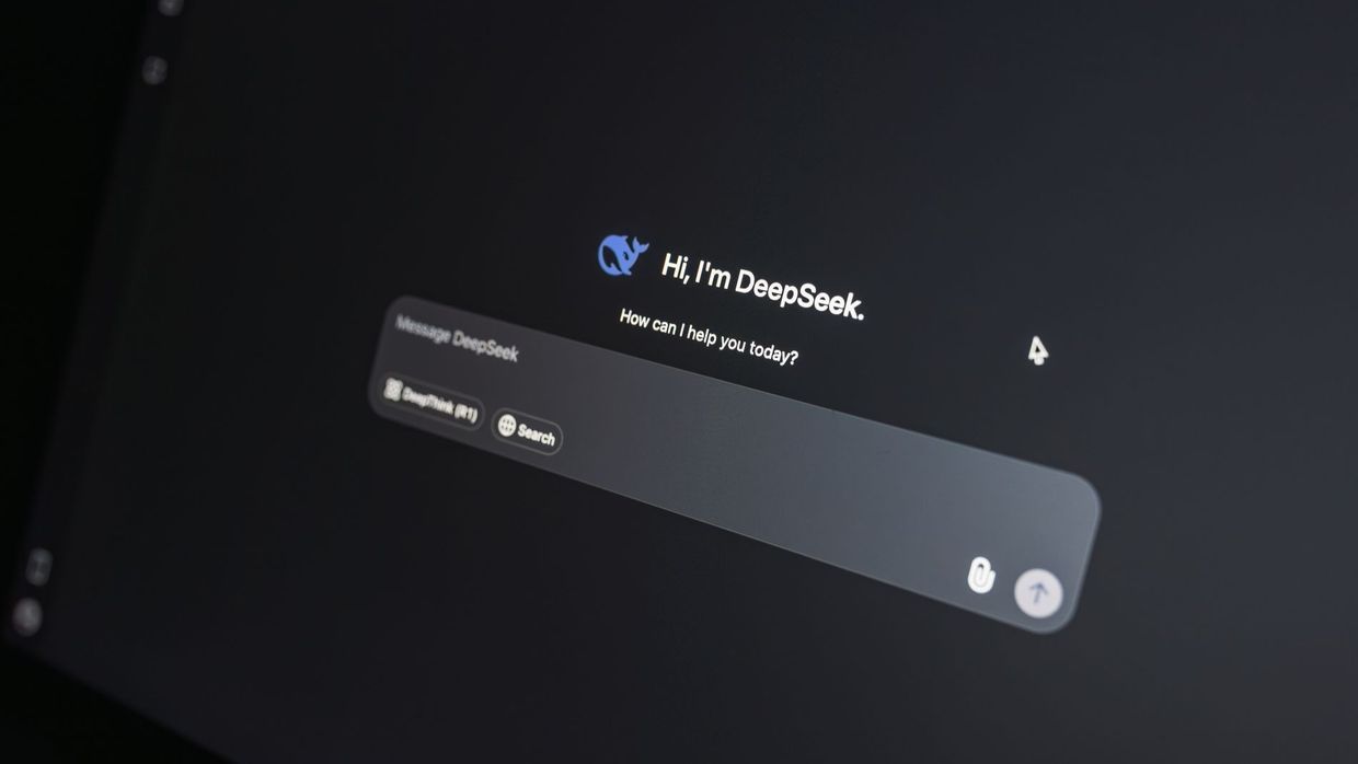 Prompt engineering for SEO: close-up of DeepSeek AI chat interface on a laptop screen in low light
