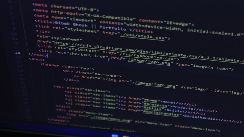 High-resolution close-up of HTML code displayed on a computer screen, perfect for technology themes