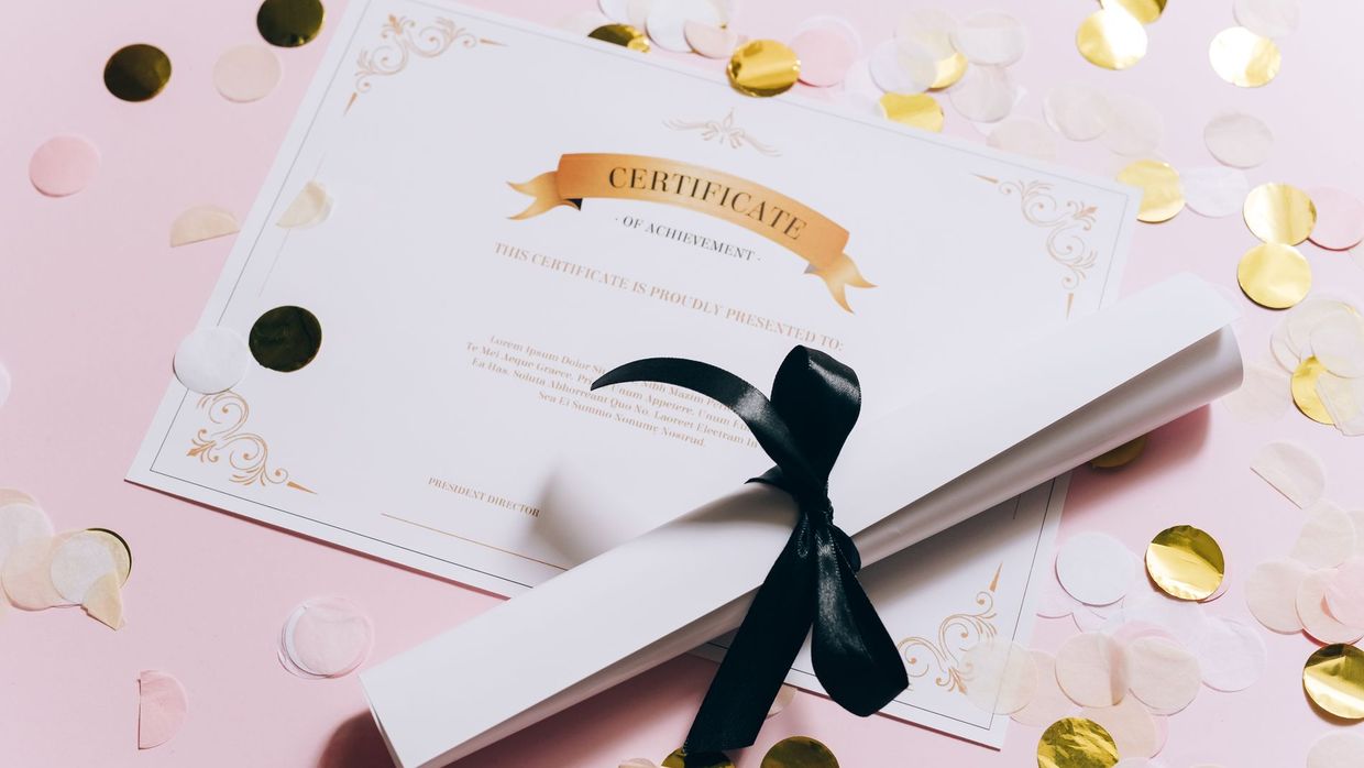 Semrush Academy certifications: elegant certificate of achievement on a pink surface with confetti. Perfect for celebrations