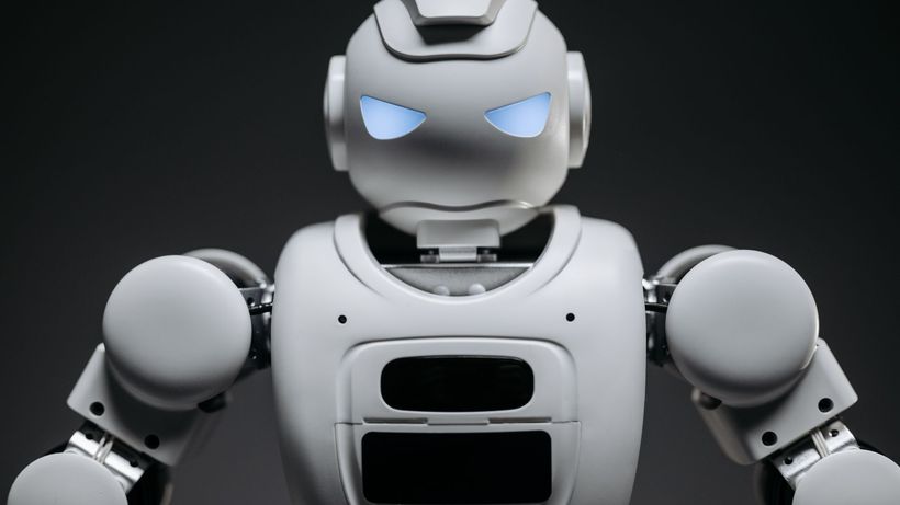 Detailed studio shot of a modern robotic toy with a dark background, showcasing technological design