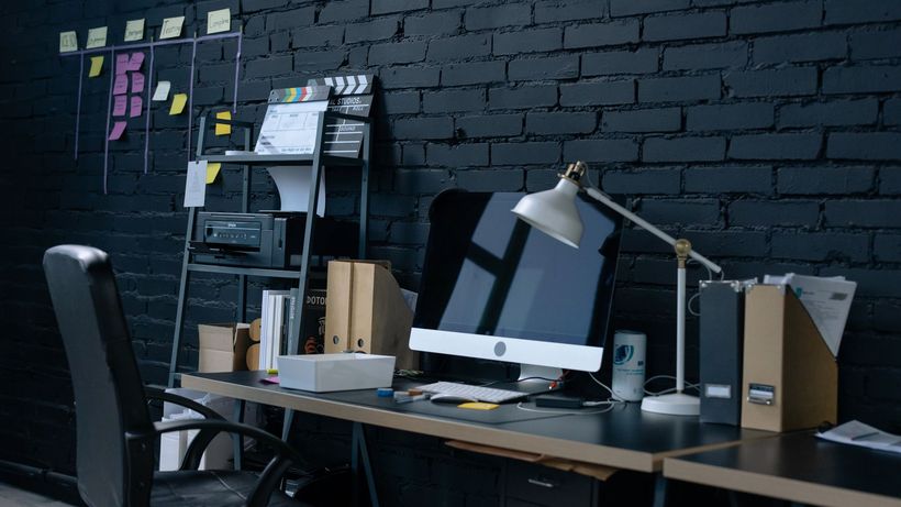 Stylish home office setup with desktop computer and organized workspace