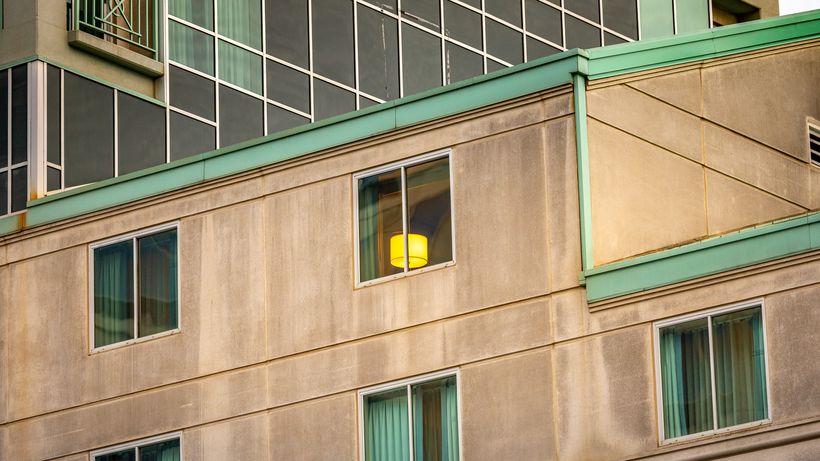 Close-up of modern urban building facade with prominent windows