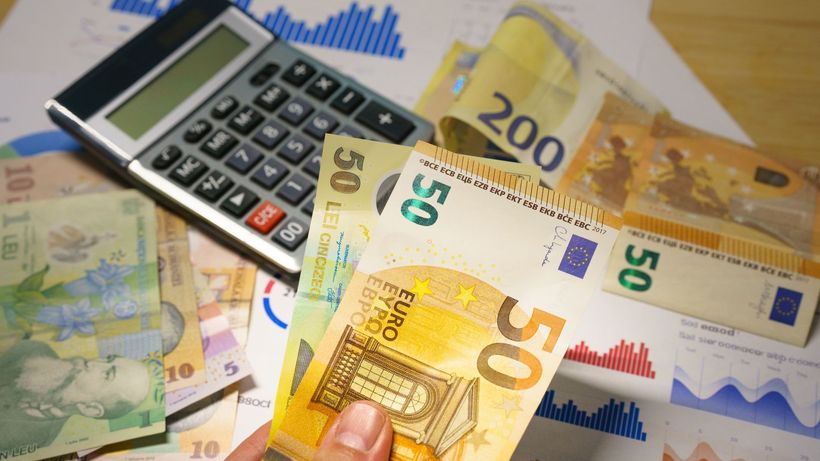 Euro and Romanian Lei currency with calculator on a financial desk setup