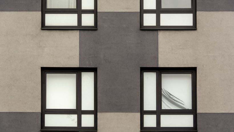 Geometric facade featuring symmetrical windows on a modern building