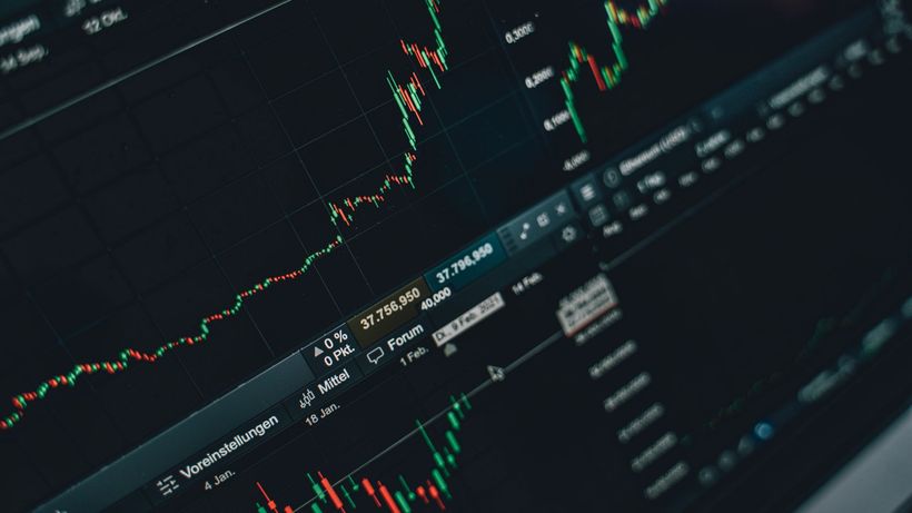 Close-up of stock market trading screen displaying financial growth and charts