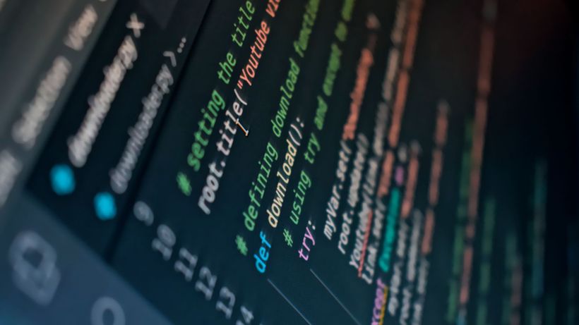 Detailed view of computer code highlighting syntax in colors on a screen