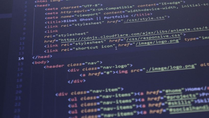Close-up view of HTML and CSS code displayed on a computer screen, ideal for programming and technology themes